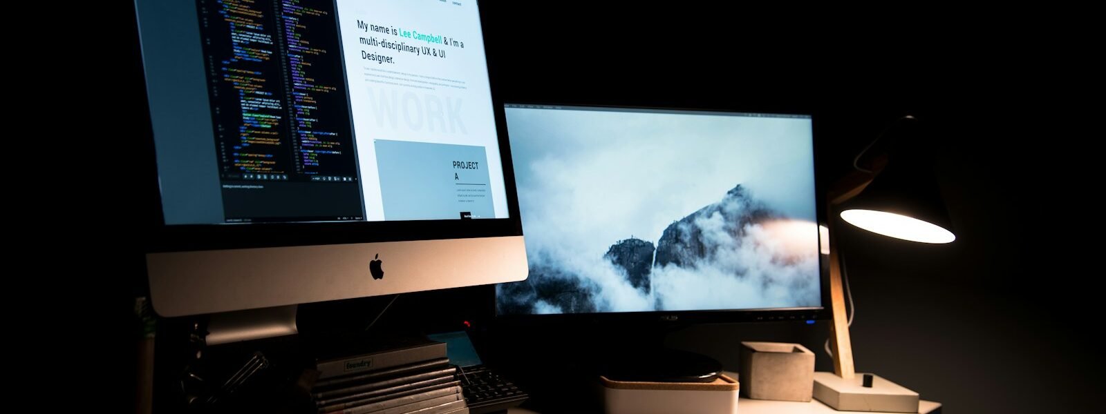 silver iMac turned on inside room